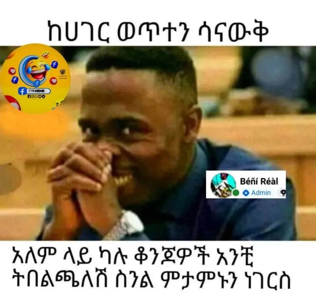 a man in a blue shirt is sitting in a lecture room